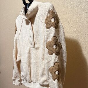 Polar Fleece pullover sweatshirt with floral sleeve detail snap closure plush